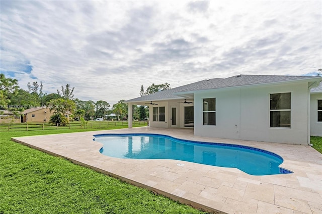 swimming pool featuring ceiling fan and a patio