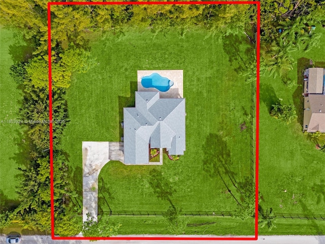aerial view of property and surrounding area with property parcel outlined