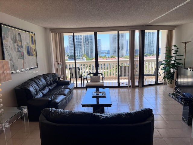 1000 Island Blvd Unit 1508, Aventura, FL 33160 - tiled living room with a wall of windows and a textured ceiling