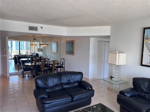1000 Island Blvd Unit 1508, Aventura, FL 33160 - living area featuring light tile patterned floors and a textured ceiling