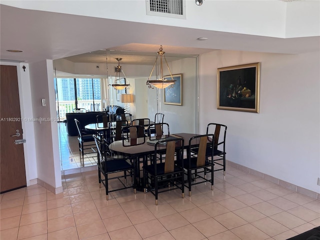 1000 Island Blvd Unit 1508, Aventura, FL 33160 - dining room with light tile patterned flooring and baseboards