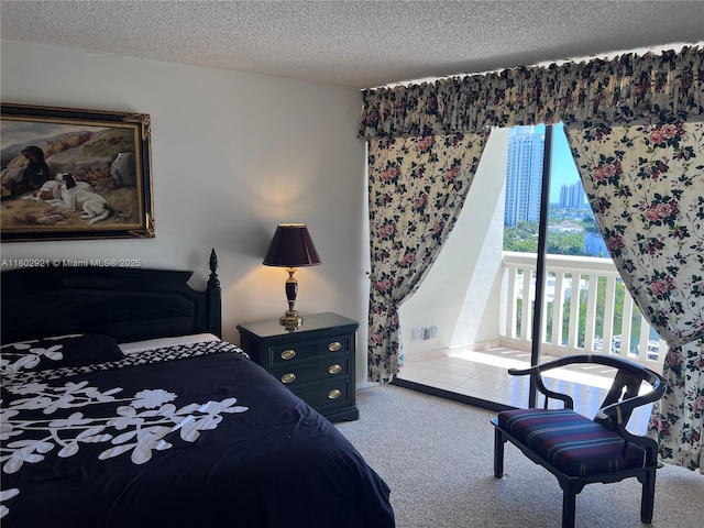 1000 Island Blvd Unit 1508, Aventura, FL 33160 - bedroom with carpet flooring, access to exterior, and a textured ceiling