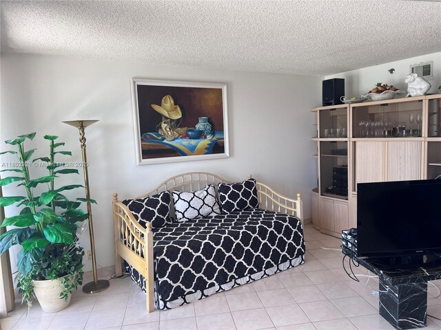1000 Island Blvd Unit 1508, Aventura, FL 33160 - tiled bedroom featuring a textured ceiling