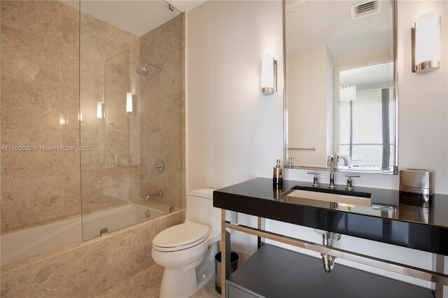 9705 Collins Ave Unit 1805N, Bal Harbour, FL 33154 - bathroom featuring toilet, shower / tub combination, vanity, and tile patterned floors