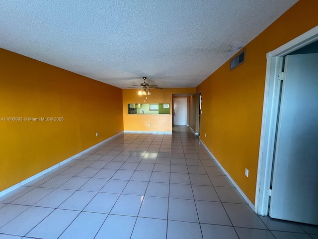 10290 NW 9th St Cir Unit 512, Miami, FL 33172 - empty room with a ceiling fan, a textured ceiling, light tile patterned flooring, and baseboards