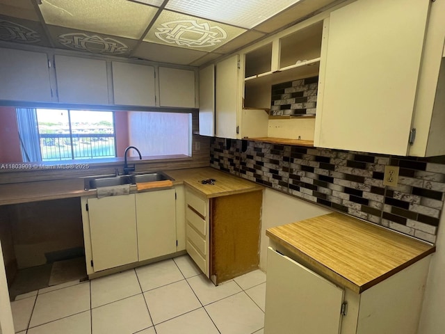 10290 NW 9th St Cir Unit 512, Miami, FL 33172 - kitchen featuring a sink, light tile patterned floors, decorative backsplash, and open shelves