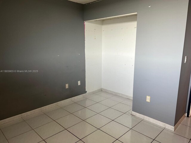 10290 NW 9th St Cir Unit 512, Miami, FL 33172 - spare room featuring light tile patterned floors and baseboards