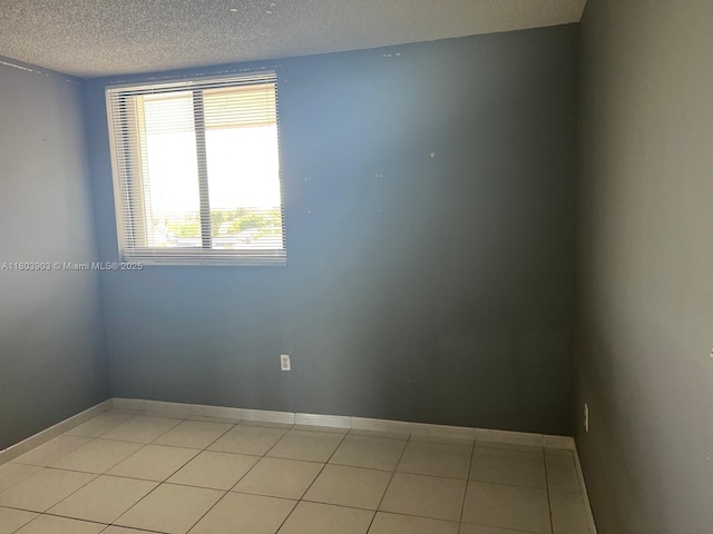 10290 NW 9th St Cir Unit 512, Miami, FL 33172 - spare room with a textured ceiling and light tile patterned floors