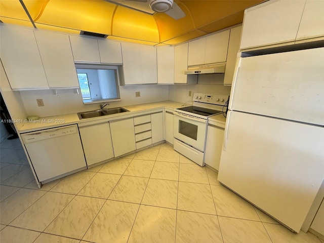 2305 Lucaya Ln Unit H1, Coconut Creek, FL 33066 - kitchen with white appliances, a sink, light countertops, under cabinet range hood, and light tile patterned floors