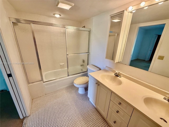 2305 Lucaya Ln Unit H1, Coconut Creek, FL 33066 - full bathroom featuring toilet, double vanity, combined bath / shower with glass door, and tile patterned flooring