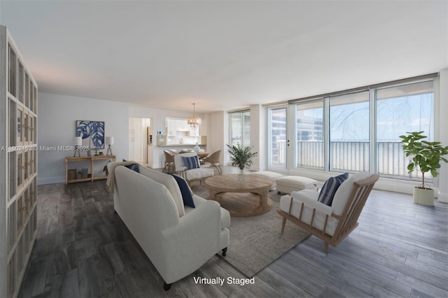 4280 Galt Ocean Dr Unit 23A, Fort Lauderdale, FL 33308 - living room with a chandelier, dark wood finished floors, and baseboards