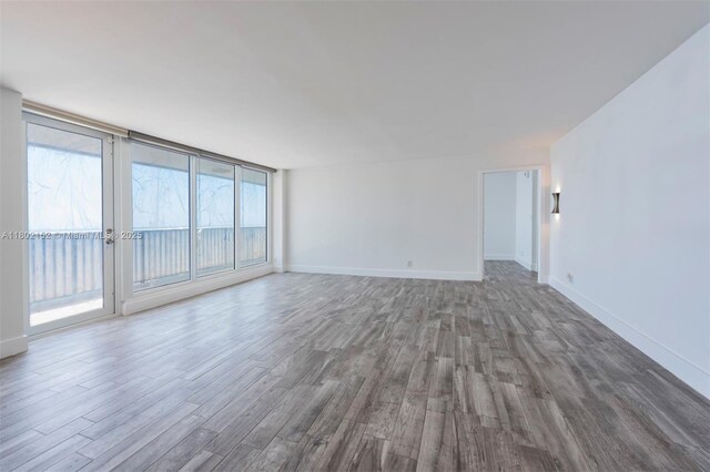 4280 Galt Ocean Dr Unit 23A, Fort Lauderdale, FL 33308 - empty room with wood finished floors and baseboards