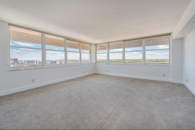 4280 Galt Ocean Dr Unit 23A, Fort Lauderdale, FL 33308 - empty room with light carpet, plenty of natural light, and baseboards
