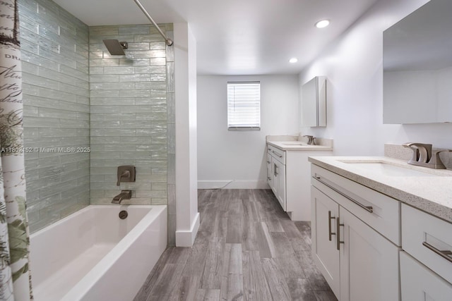 4280 Galt Ocean Dr Unit 23A, Fort Lauderdale, FL 33308 - full bath with two vanities, wood finished floors, shower / bath combo, baseboards, and recessed lighting