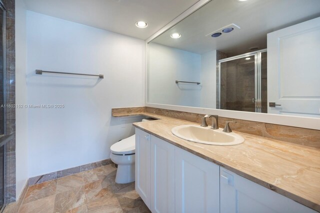 4280 Galt Ocean Dr Unit 23A, Fort Lauderdale, FL 33308 - full bathroom featuring a stall shower, toilet, vanity, recessed lighting, and stone finish flooring