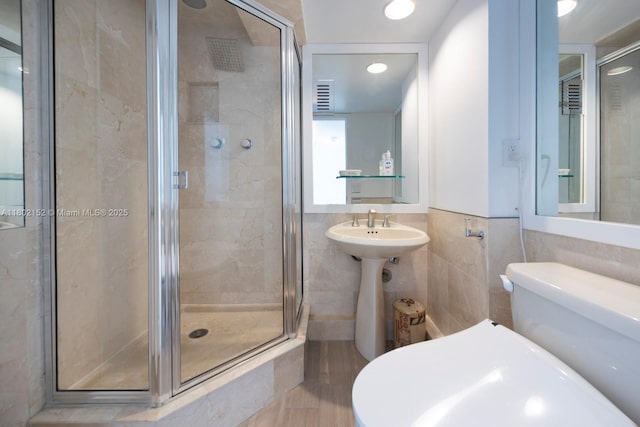 4280 Galt Ocean Dr Unit 23A, Fort Lauderdale, FL 33308 - full bathroom featuring a shower stall, tile walls, toilet, a sink, and recessed lighting
