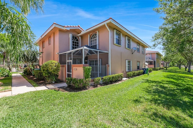 11832 Royal Palm Blvd, Coral Springs, FL 33065 - view of home's exterior with stucco siding, a yard, and a tiled roof