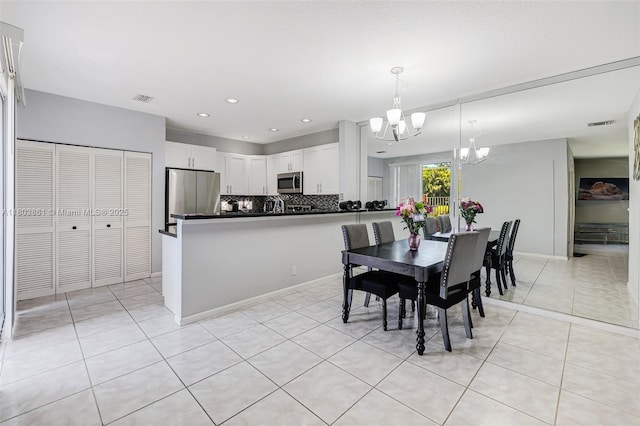 11832 Royal Palm Blvd, Coral Springs, FL 33065 - dining space with a chandelier, light tile patterned floors, and recessed lighting