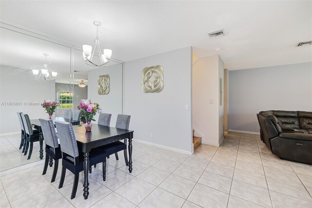 11832 Royal Palm Blvd, Coral Springs, FL 33065 - dining area featuring a chandelier, light tile patterned floors, baseboards, and stairs