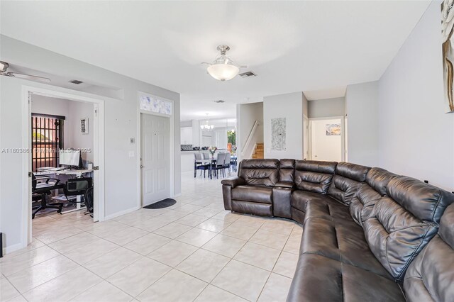 11832 Royal Palm Blvd, Coral Springs, FL 33065 - living area featuring a desk, light tile patterned floors, a chandelier, and baseboards