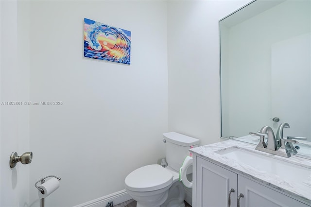 11832 Royal Palm Blvd, Coral Springs, FL 33065 - bathroom featuring toilet, vanity, and baseboards