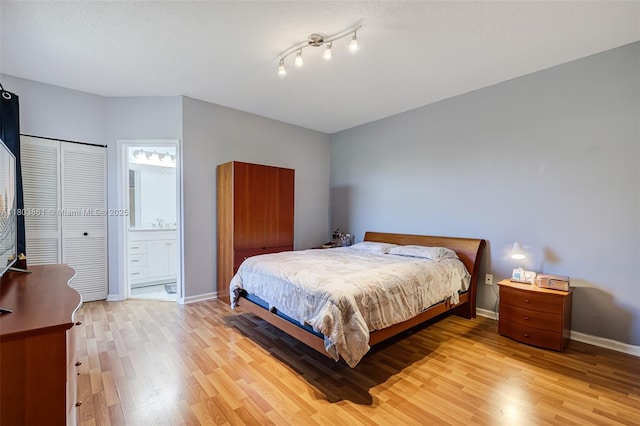 11832 Royal Palm Blvd, Coral Springs, FL 33065 - bedroom with light wood-style flooring, baseboards, and ensuite bath