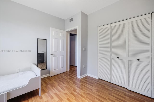 11832 Royal Palm Blvd, Coral Springs, FL 33065 - unfurnished bedroom featuring light wood finished floors, a closet, and baseboards