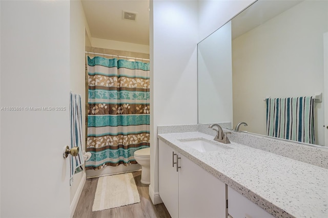 11832 Royal Palm Blvd, Coral Springs, FL 33065 - bathroom featuring toilet, wood finished floors, and vanity