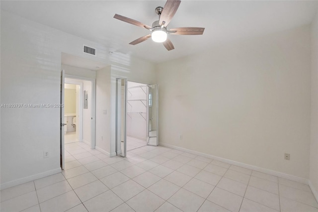 7739 Southampton Ter Unit 415, Tamarac, FL 33321 - unfurnished bedroom with light tile patterned floors, a ceiling fan, and baseboards