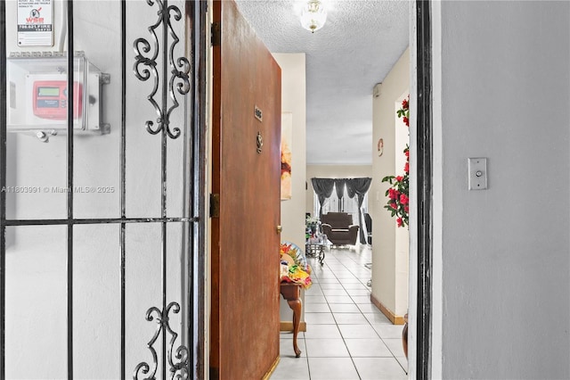 1215 SW 32nd Ave Unit 108A, Miami, FL 33135 - hallway with light tile patterned floors and a textured ceiling