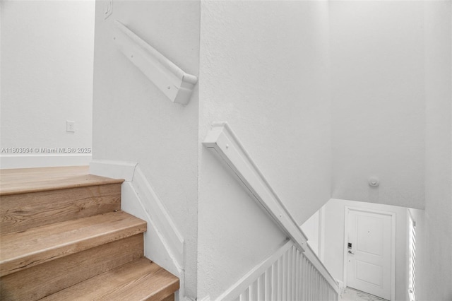 21408 NE 2nd Path, Miami, FL 33179 - staircase featuring a textured wall