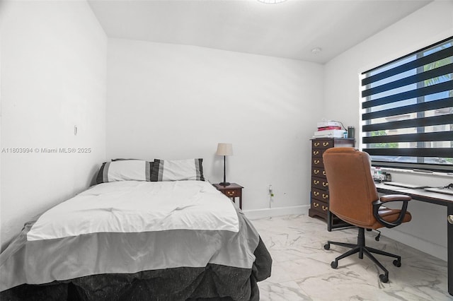 21408 NE 2nd Path, Miami, FL 33179 - bedroom with marble look tile flooring, an office area, and baseboards