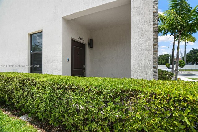 21408 NE 2nd Path, Miami, FL 33179 - property entrance with stucco siding