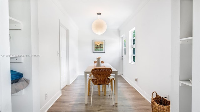 516 Puritan Rd, West Palm Beach, FL 33405 - corridor featuring wood finished floors and crown molding