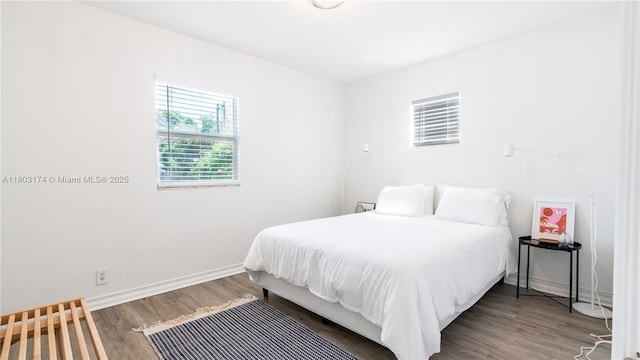 516 Puritan Rd, West Palm Beach, FL 33405 - bedroom featuring wood finished floors and baseboards