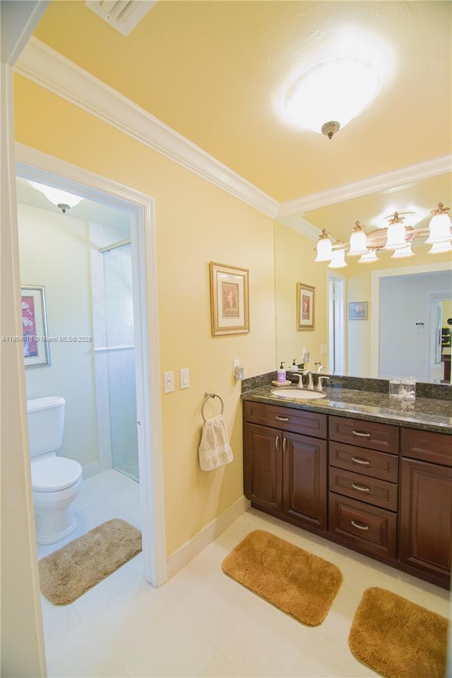 10715 SW 139th Ct, Miami, FL 33186 - bathroom with crown molding, toilet, vanity, a stall shower, and baseboards