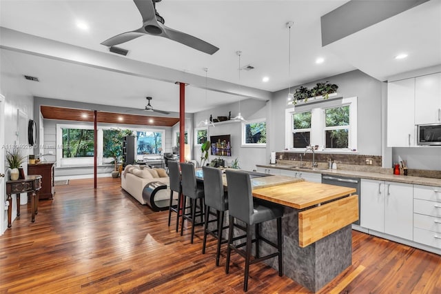 1631 SW 11th St, Miami, FL 33135 - kitchen with a ceiling fan, wood counters, a sink, stainless steel appliances, and dark wood-type flooring