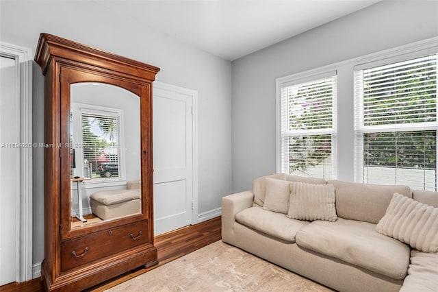 1631 SW 11th St, Miami, FL 33135 - living room featuring plenty of natural light, wood finished floors, and baseboards