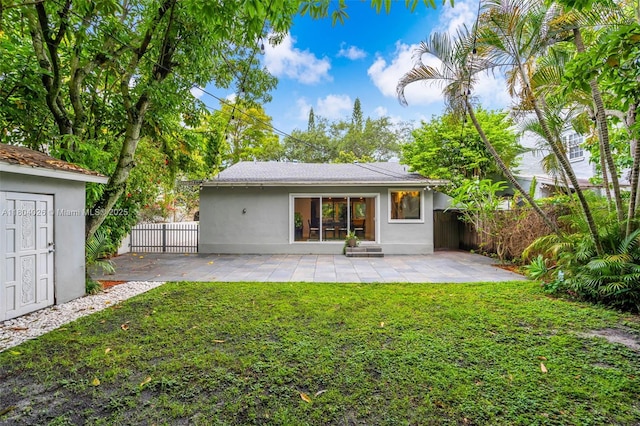 1631 SW 11th St, Miami, FL 33135 - back of house featuring stucco siding and a patio