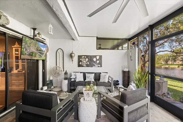 1150 NW 99th Ave Unit 69, Pembroke Pines, FL 33024 - sunroom / solarium featuring outdoor lounge area, a ceiling fan, and a water view