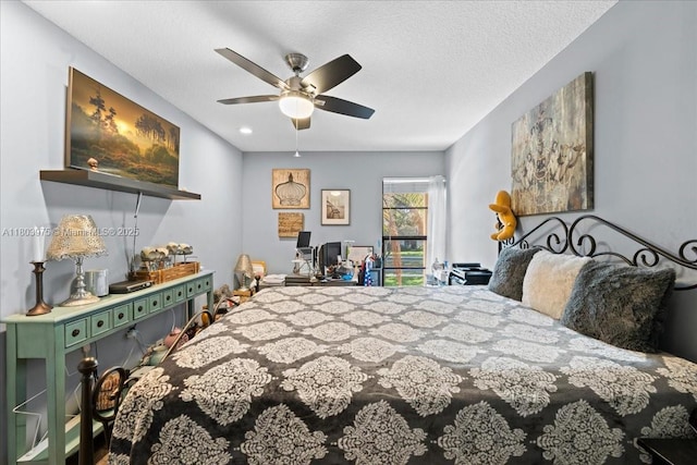 1150 NW 99th Ave Unit 69, Pembroke Pines, FL 33024 - bedroom with a ceiling fan and a textured ceiling