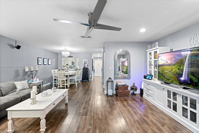 1150 NW 99th Ave Unit 69, Pembroke Pines, FL 33024 - living area with a chandelier, baseboards, wood finished floors, ceiling fan, and a textured ceiling