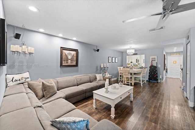 1150 NW 99th Ave Unit 69, Pembroke Pines, FL 33024 - living room featuring a chandelier, dark wood finished floors, a textured ceiling, baseboards, and recessed lighting