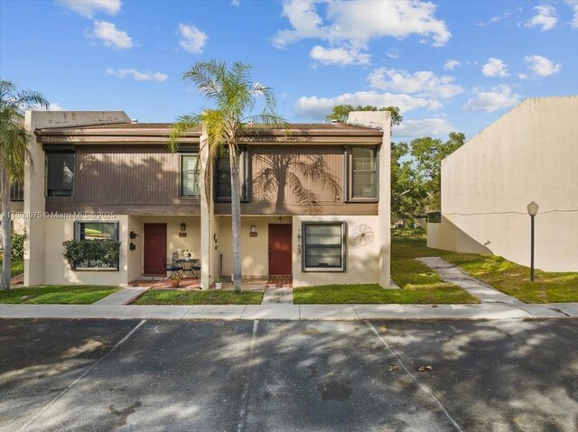 1150 NW 99th Ave Unit 69, Pembroke Pines, FL 33024 - view of property featuring stucco siding