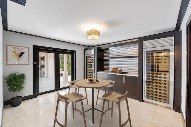 3310 Granada Blvd, Coral Gables, FL 33134 - dining space with wine cooler and light marble finish floors