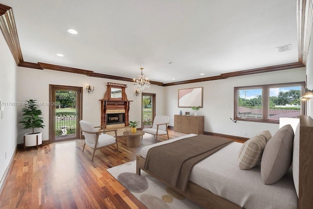 3310 Granada Blvd, Coral Gables, FL 33134 - bedroom with ornamental molding, a fireplace with raised hearth, multiple windows, access to outside, and a chandelier