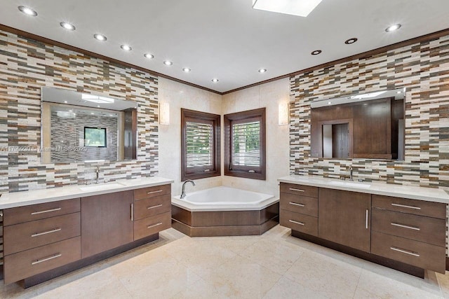 3310 Granada Blvd, Coral Gables, FL 33134 - full bath featuring tile patterned flooring, two vanities, crown molding, backsplash, and recessed lighting