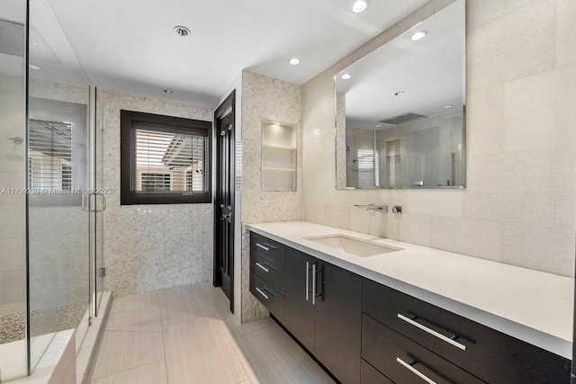 3310 Granada Blvd, Coral Gables, FL 33134 - bathroom featuring a stall shower, tile walls, and vanity