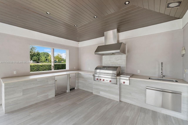 3310 Granada Blvd, Coral Gables, FL 33134 - kitchen featuring wall chimney range hood, a sink, wood ceiling, stainless steel built in fridge, and light countertops