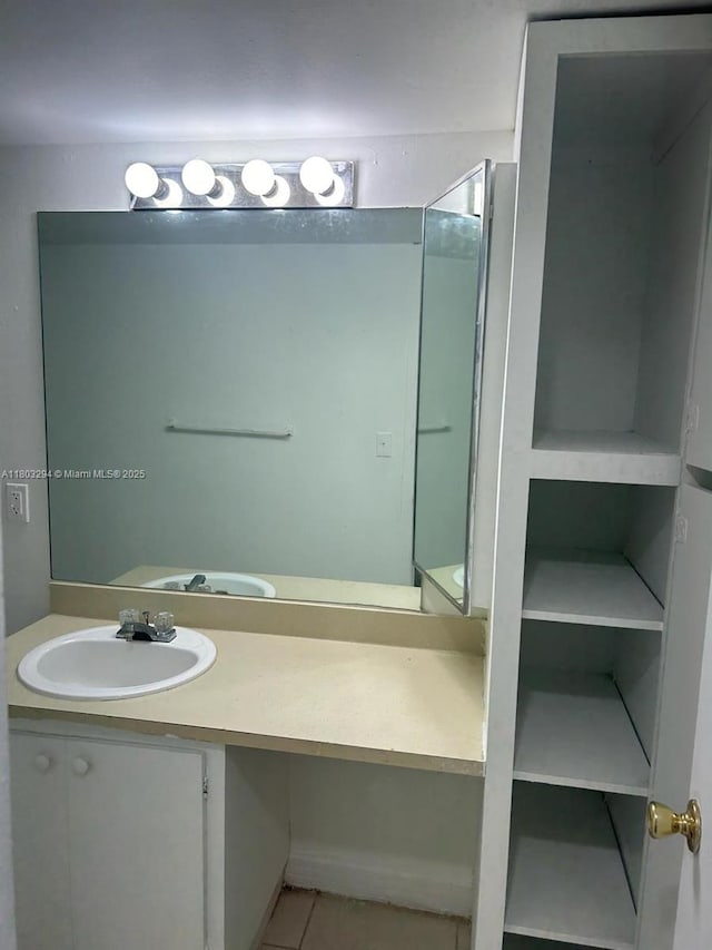 bathroom with vanity and tile patterned floors